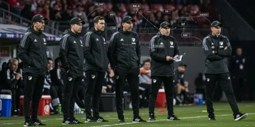 MLS Coaching Evolution: Trends Shaping Team Performance 2025+ MLS coaches strategizing with digital data overlays