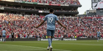 MLS Designated Player celebrating goal in a packed stadium