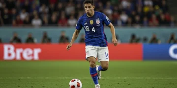 US soccer player showcasing versatile skills on the field in a 2025 match.