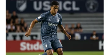 USL player dribbling with MLS stadium in background, symbolizing career progression