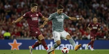 MLS defender making a tackle, showcasing key defensive tactical trends