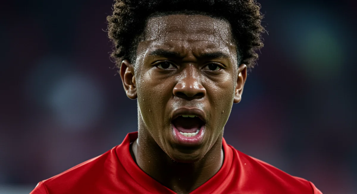 Focused young soccer player displaying mental resilience in game